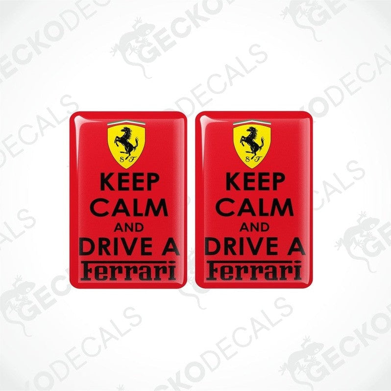 Two rectangular red vinyl decals with 'KEEP CALM AND DRIVE A FERRARI' text and the Ferrari logo in yellow.