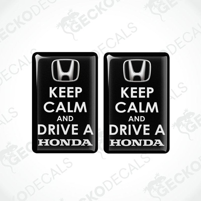 Two black vinyl decals with white text that read 'KEEP CALM AND DRIVE A HONDA'.