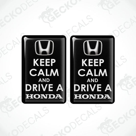 Two black vinyl decals with white text that read 'KEEP CALM AND DRIVE A HONDA'.