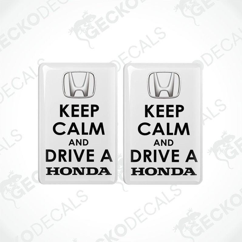 Two white vinyl decals with black text that read 'KEEP CALM AND DRIVE A HONDA'.