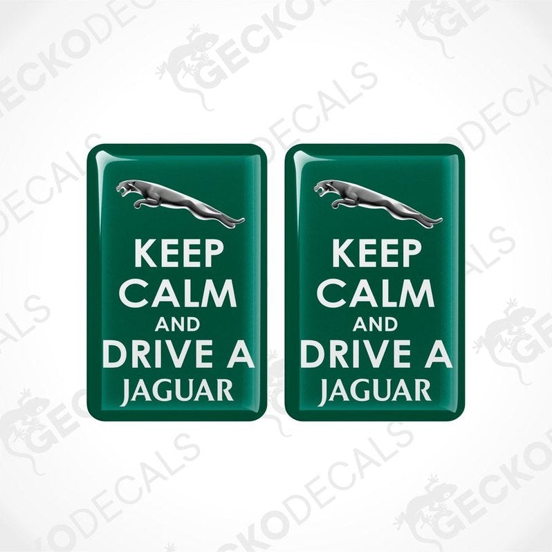 Two green vinyl stickers with 'KEEP CALM AND DRIVE A JAGUAR' text and a Jaguar logo.