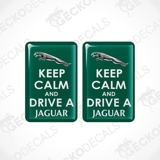 Two green vinyl stickers with 'KEEP CALM AND DRIVE A JAGUAR' text and a Jaguar logo.