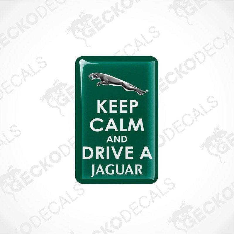 Green vinyl stickers with 'KEEP CALM AND DRIVE A JAGUAR' text and a Jaguar logo.