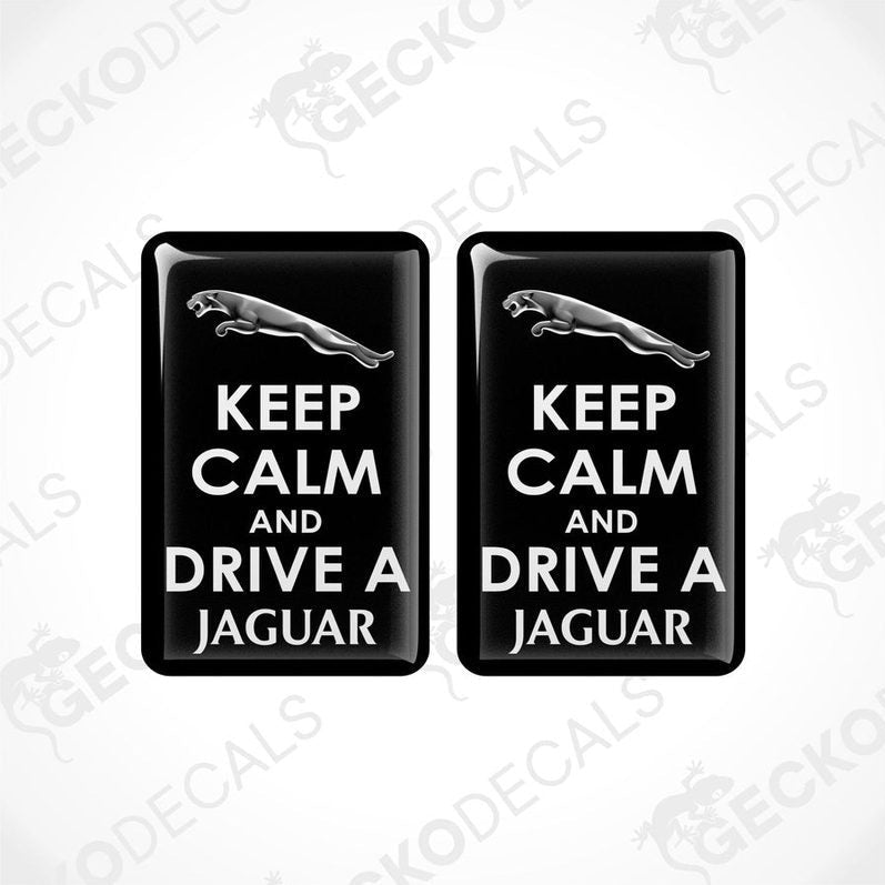 Two black vinyl decals with white text that read 'KEEP CALM AND DRIVE A JAGUAR'.