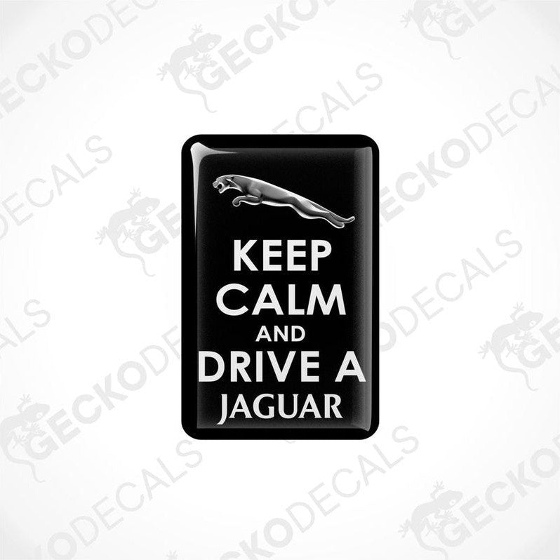 Black vinyl decals with white text that read 'KEEP CALM AND DRIVE A JAGUAR'.