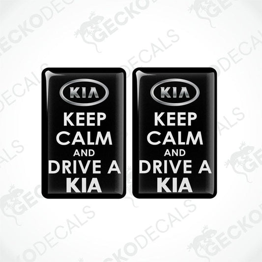 Two black vinyl decals with white text that read 'KEEP CALM AND DRIVE A KIA'.