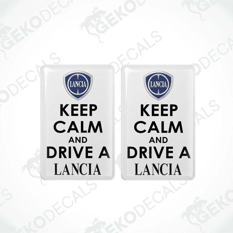 Two white vinyl decals with black text saying 'KEEP CALM AND DRIVE A LANCIA' and the Lancia logo above the text.