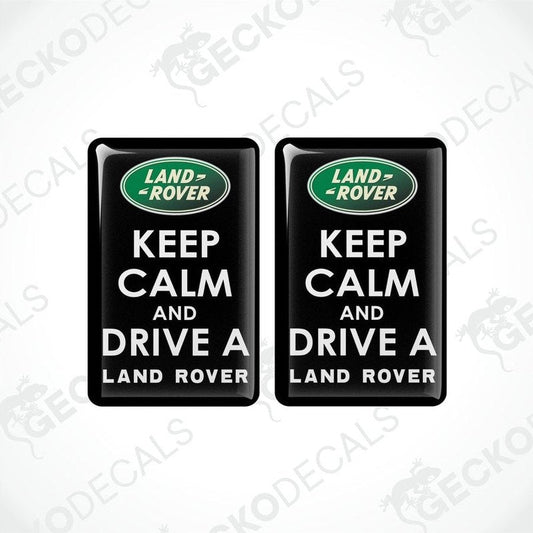 Two black vinyl stickers with the text 'KEEP CALM AND DRIVE A LAND ROVER' and the Land Rover logo.