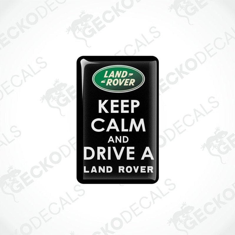 Black vinyl stickers with the text 'KEEP CALM AND DRIVE A LAND ROVER' and the Land Rover logo.