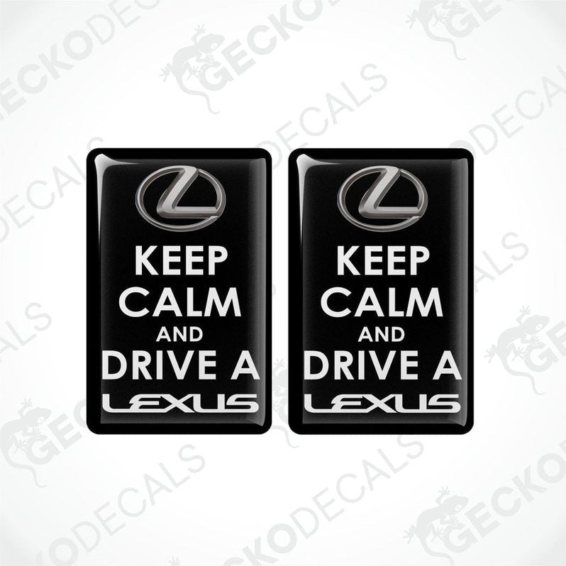 Two black vinyl stickers with the text 'KEEP CALM AND DRIVE A LEXUS' and the Lexus brand logo.
