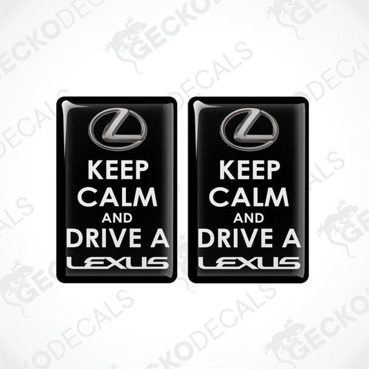 Two black vinyl stickers with the text 'KEEP CALM AND DRIVE A LEXUS' and the Lexus brand logo.