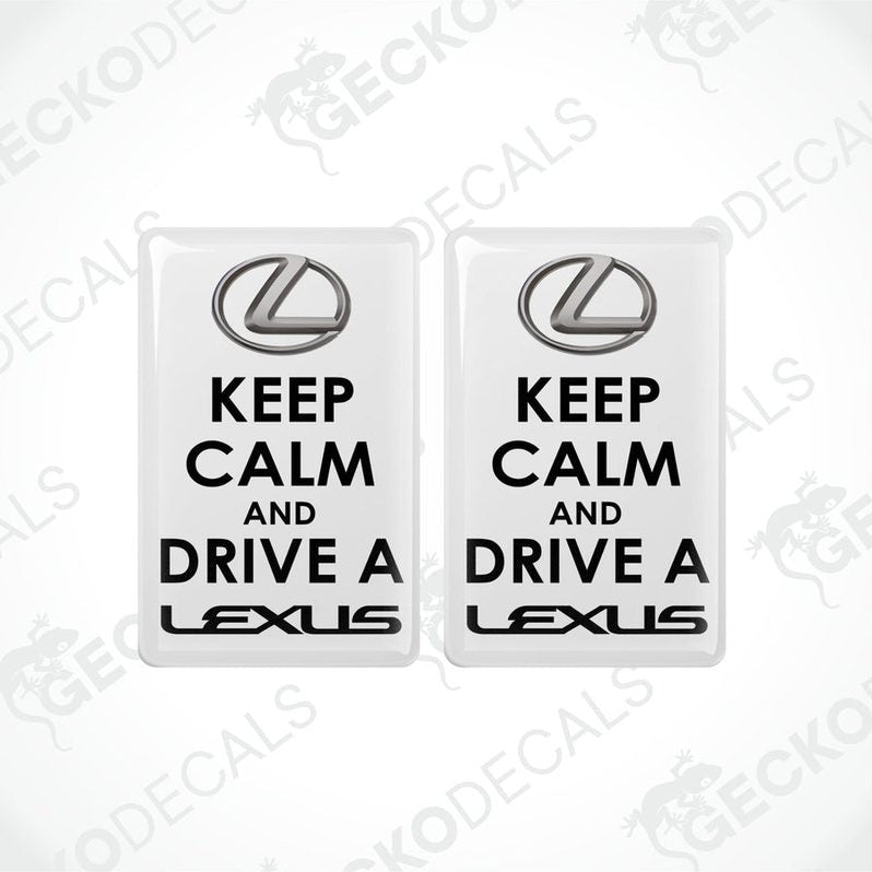 Two white vinyl stickers with the text 'KEEP CALM AND DRIVE A LEXUS' and the Lexus brand logo.