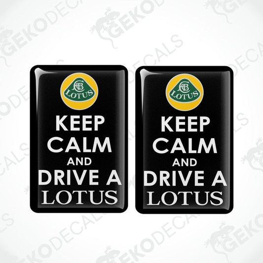Two black vinyl stickers with a 'KEEP CALM AND DRIVE A LOTUS' text and a yellow and green geometric design.