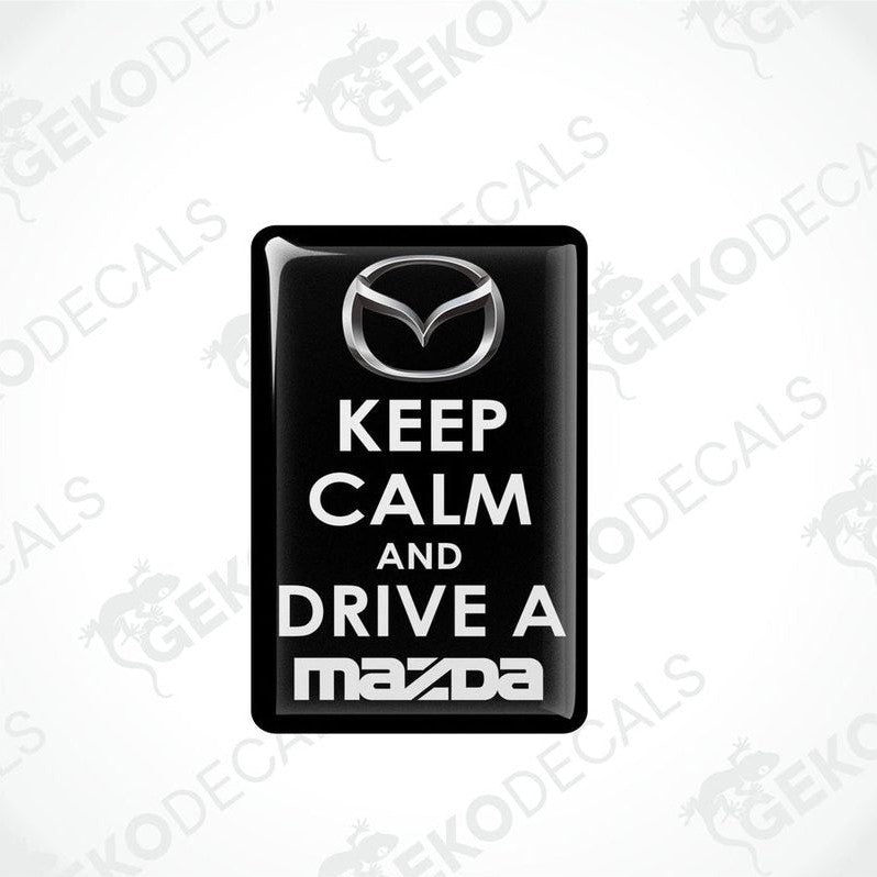  Black vinyl stickers with the text 'KEEP CALM AND DRIVE A MAZDA' and the Mazda logo.