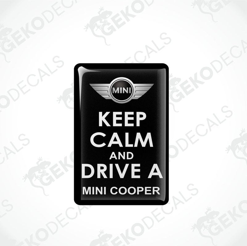 Black vinyl stickers with the text 'KEEP CALM AND DRIVE A MINI COOPER' and the MINI COOPER logo in the center.