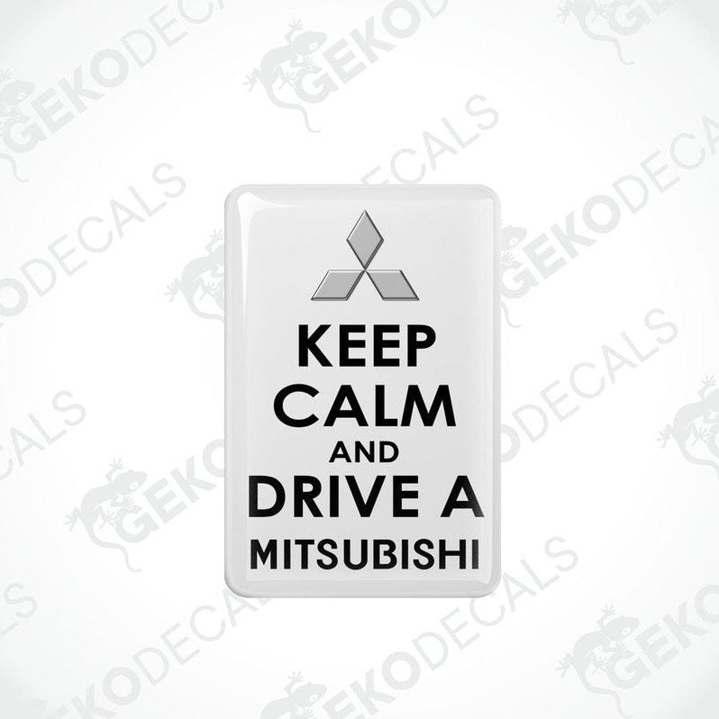  White vinyl stickers with the text 'KEEP CALM AND DRIVE A MITSUBISHI' and a black triangle logo on each sticker.