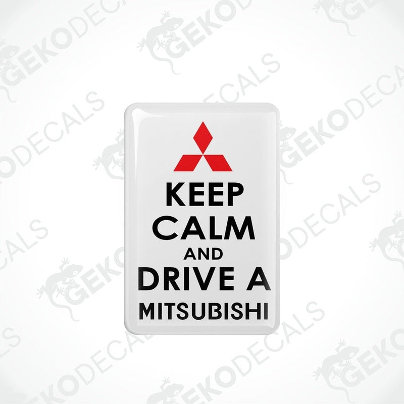  White vinyl stickers with the text 'KEEP CALM AND DRIVE A MITSUBISHI' and a black triangle logo on each sticker.