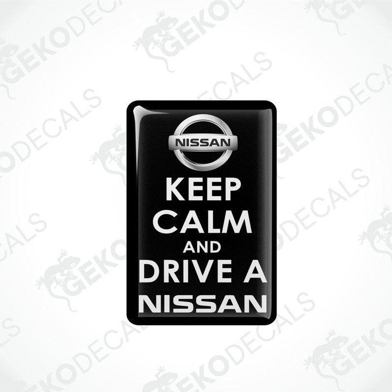Black vinyl stickers with the text 'KEEP CALM AND DRIVE A NISSAN' and the NISSAN logo.