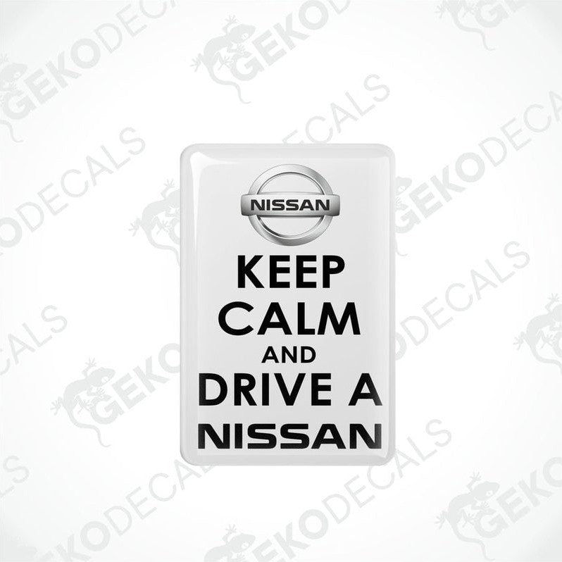 White vinyl stickers with the text 'KEEP CALM AND DRIVE A NISSAN' and the NISSAN logo.