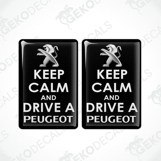 Two black vinyl stickers with the text 'KEEP CALM AND DRIVE A PEUGEOT' and the Peugeot logo.
