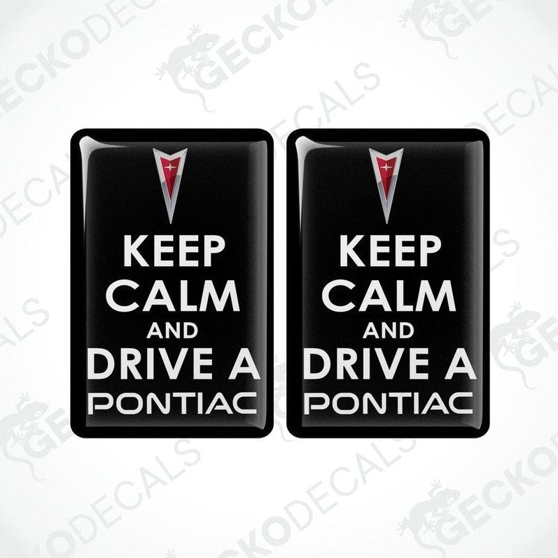 Two rectangular black vinyl decals with the text 'KEEP CALM AND DRIVE A PONTIAC' and the Pontiac logo in red and white.