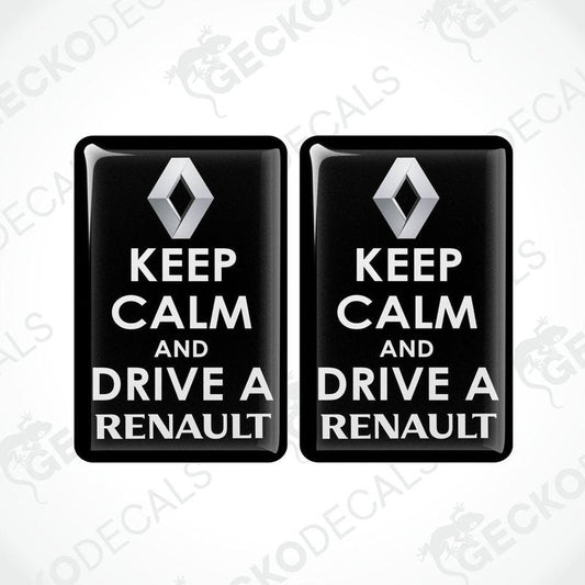 Two black vinyl stickers with the text 'KEEP CALM AND DRIVE A RENAULT' and the Renault logo.
