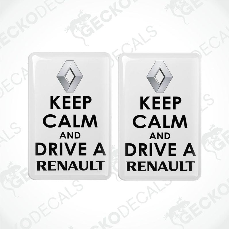 Two withe vinyl stickers with the text 'KEEP CALM AND DRIVE A RENAULT' and the Renault logo.