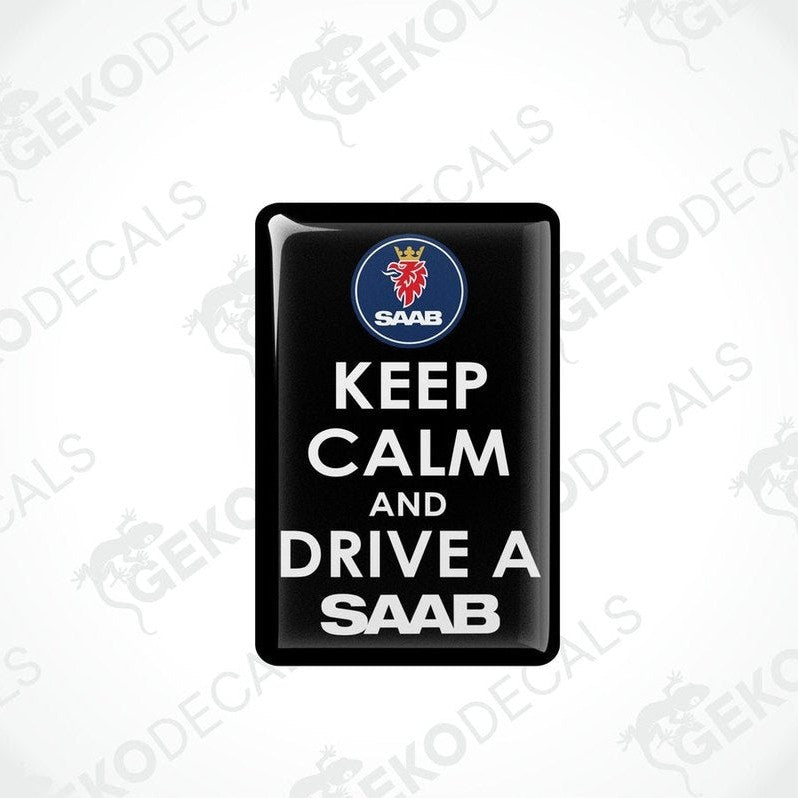 Rectangular black vinyl decals with white text and the Saab car logo at the top, one decal saying 'KEEP CALM AND DRIVE A SAAB' and the other with a mirror image of the text and logo.