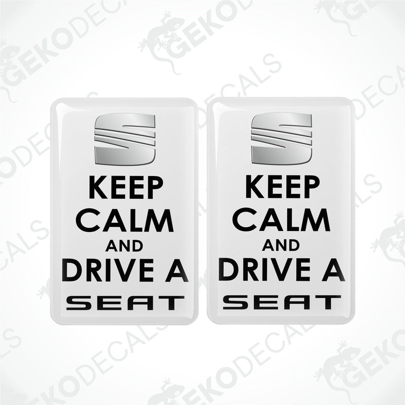 Two rectangular withe vehicle decals with black text saying 'KEEP CALM AND DRIVE A SEAT'