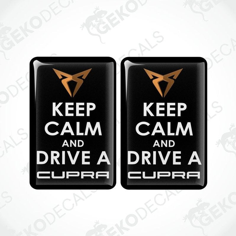 Two rectangular black vehicle decals with white text saying 'KEEP CALM AND DRIVE A SEAT CUPRA'