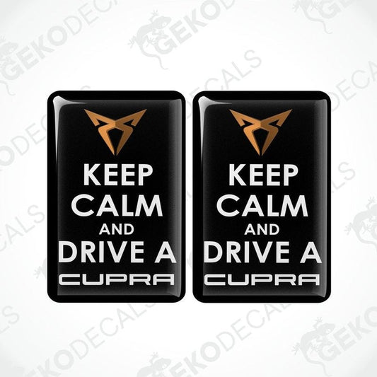 Two rectangular black vehicle decals with white text saying 'KEEP CALM AND DRIVE A SEAT CUPRA'