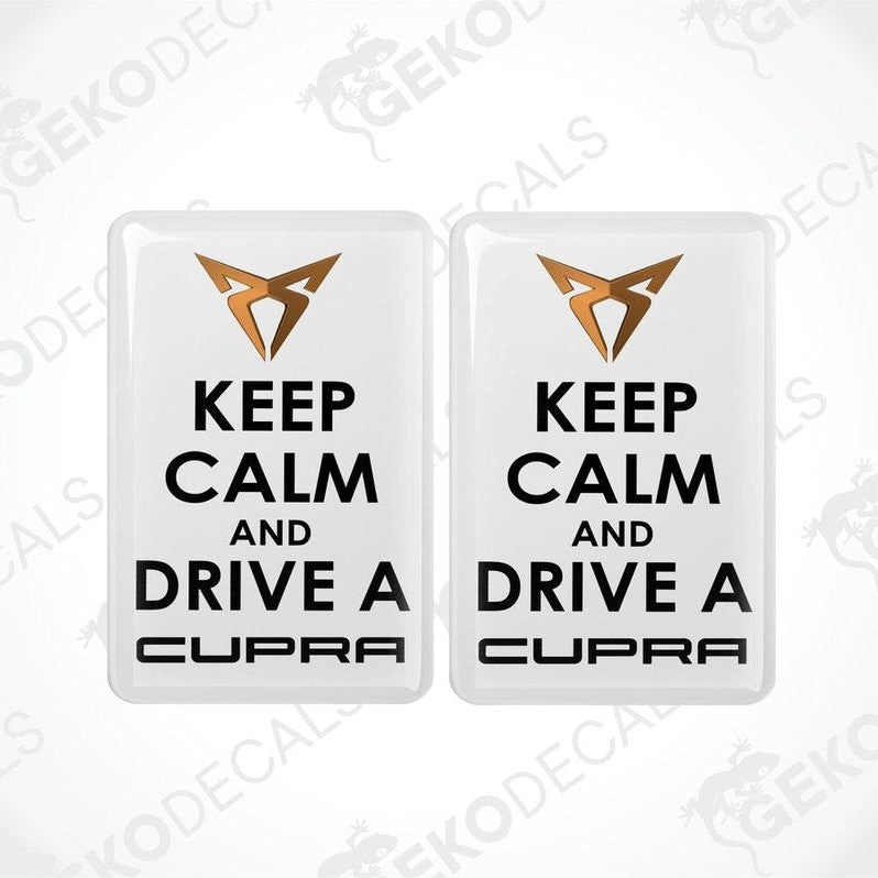Two rectangular withe vehicle decals with black text saying 'KEEP CALM AND DRIVE A SEAT CUPRA'