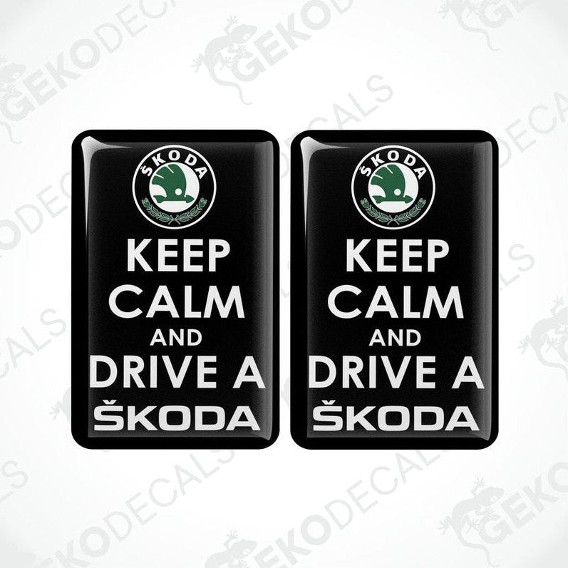 Two black vinyl stickers with the text 'KEEP CALM AND DRIVE A SKODA' and the Skoda logo.