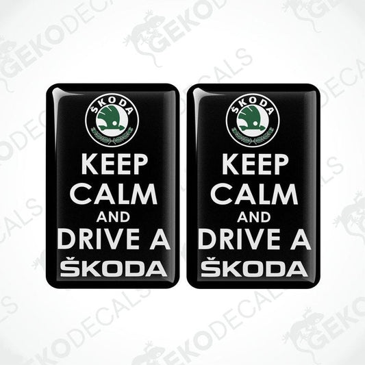 Two black vinyl stickers with the text 'KEEP CALM AND DRIVE A SKODA' and the Skoda logo.