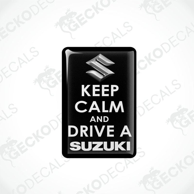 Black vinyl stickers with the text 'KEEP CALM AND DRIVE A SUZUKI' and the Suzuki logo.
