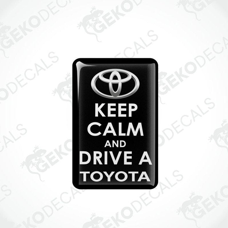  Rectangular black vehicle decals with white text that read 'KEEP CALM AND DRIVE A TOYOTA', including the Toyota logo.