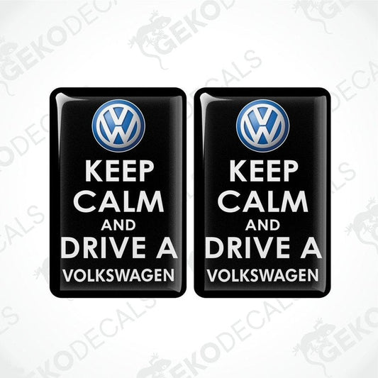 Two black vinyl stickers with the text 'KEEP CALM AND DRIVE A VOLKSWAGEN' and a VOLKSWAGEN logo on them.