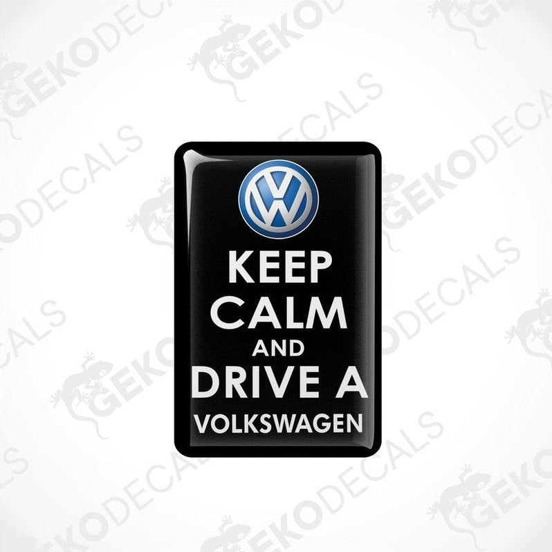 Black vinyl stickers with the text 'KEEP CALM AND DRIVE A VOLKSWAGEN' and a VOLKSWAGEN logo on them.