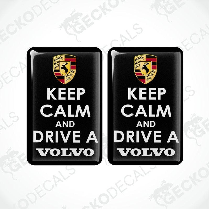 Two black vinyl stickers with the text 'KEEP CALM AND DRIVE A VOLVO' and a Volvo logo on them.