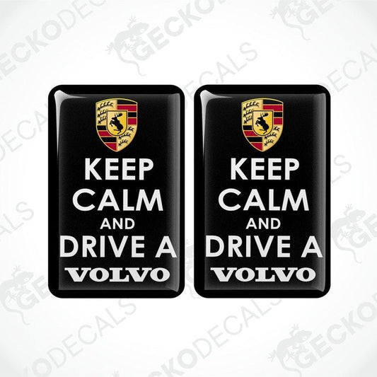 Two black vinyl stickers with the text 'KEEP CALM AND DRIVE A VOLVO' and a Volvo logo on them.