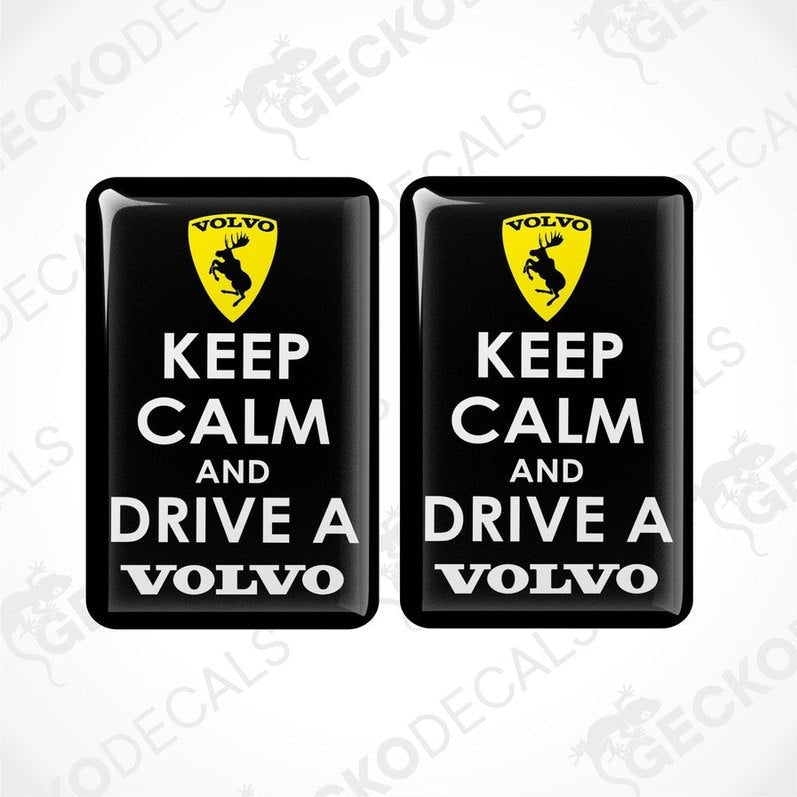 Two black vinyl stickers with the text 'KEEP CALM AND DRIVE A VOLVO' and a Volvo logo on them.