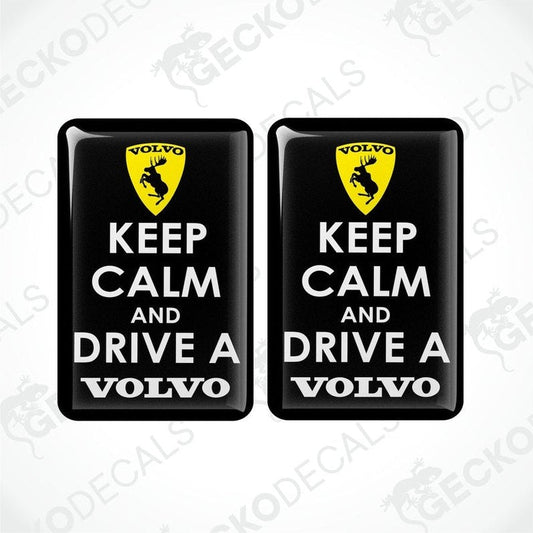 Two black vinyl stickers with the text 'KEEP CALM AND DRIVE A VOLVO' and a Volvo logo on them.