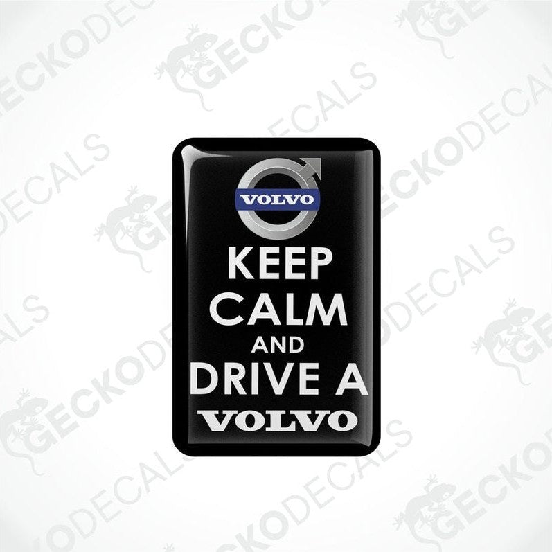  Rectangular black vinyl decals with white text and the Volvo brand logo, one decal reads 'KEEP CALM AND DRIVE A' and the other reads 'VOLVO'.