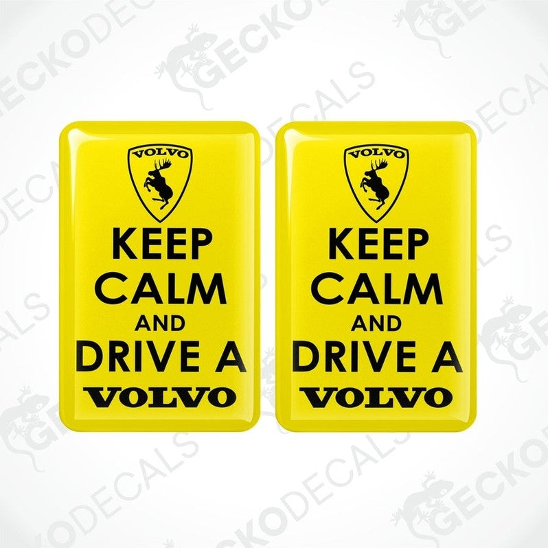 Two yellow vinyl stickers with the text 'KEEP CALM AND DRIVE A VOLVO' and a Volvo logo on them.