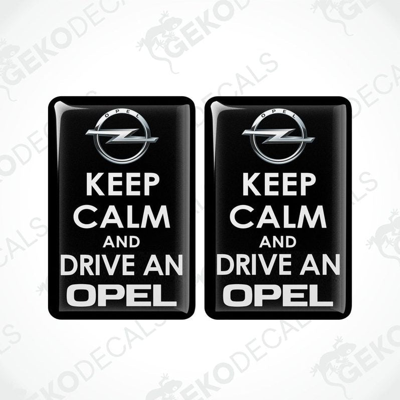 Pair of black domed epoxy resin car decals with white KEEP CALM AND DRIVE AN OPEL design
