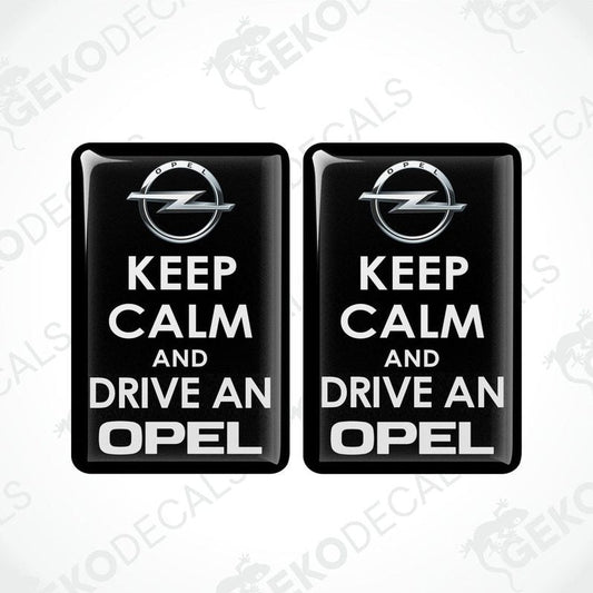 Pair of black domed epoxy resin car decals with white KEEP CALM AND DRIVE AN OPEL design