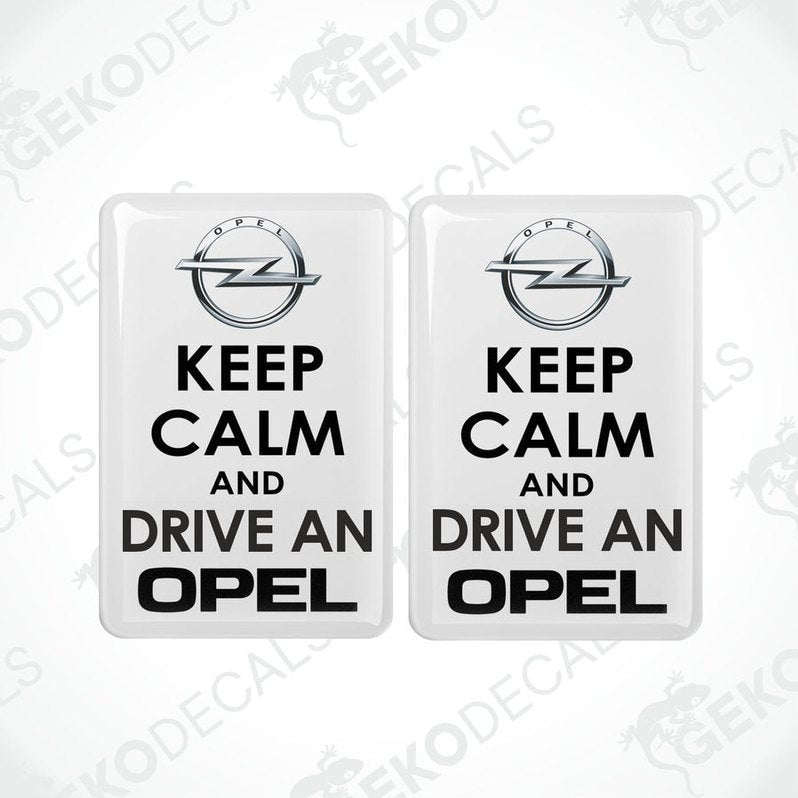 White set of two domed vinyl car stickers featuring black KEEP CALM AND DRIVE AN OPEL text
