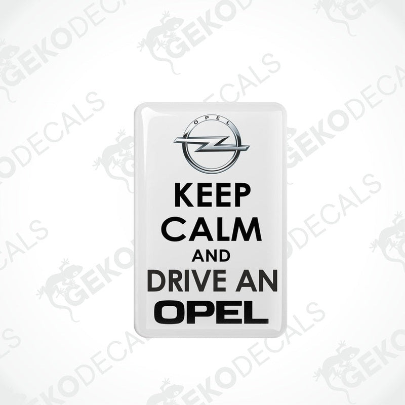 Single white rectangular domed car sticker with black KEEP CALM AND DRIVE AN OPEL lettering
