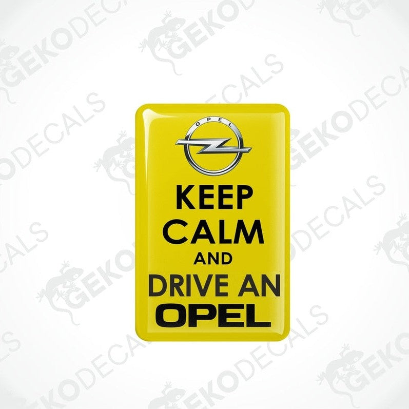 Yellow domed vinyl car decal with black KEEP CALM AND DRIVE AN OPEL text and Opel emblem