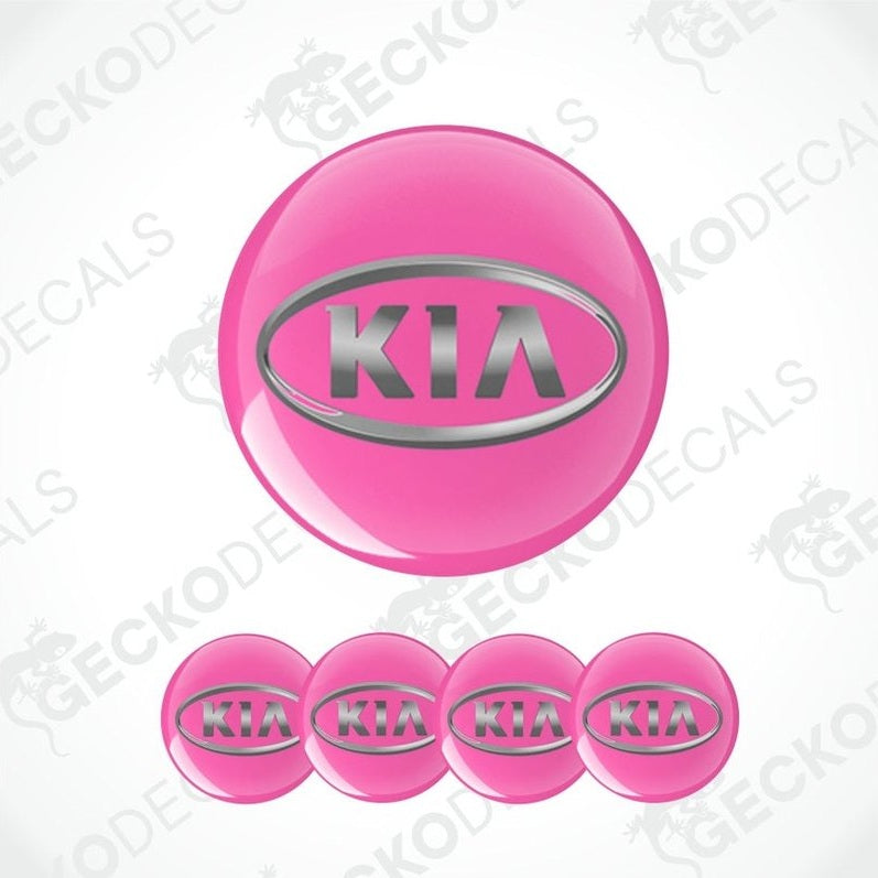 Set of pink Kia logo stickers on a white background